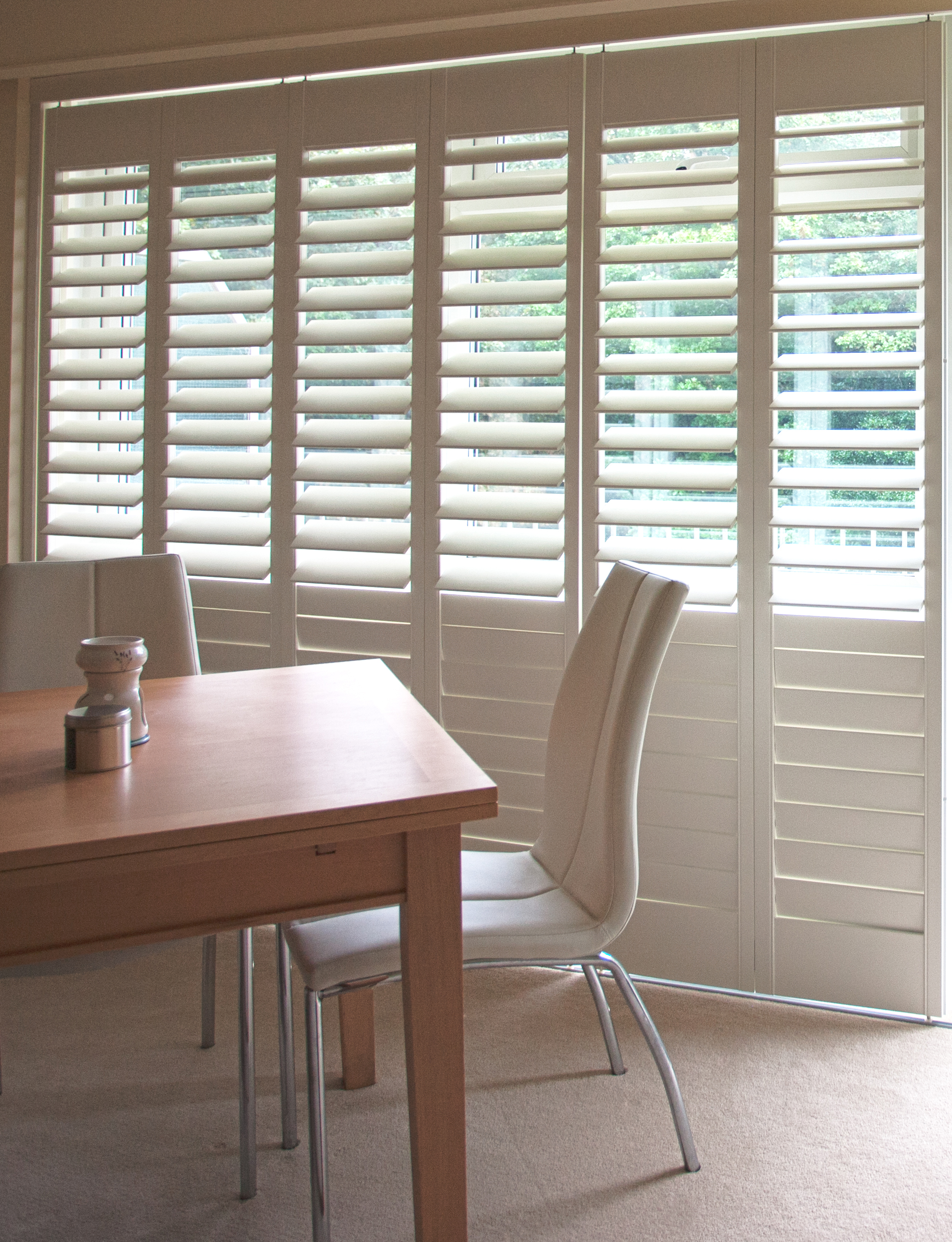 Bright room with cafe style shutters
