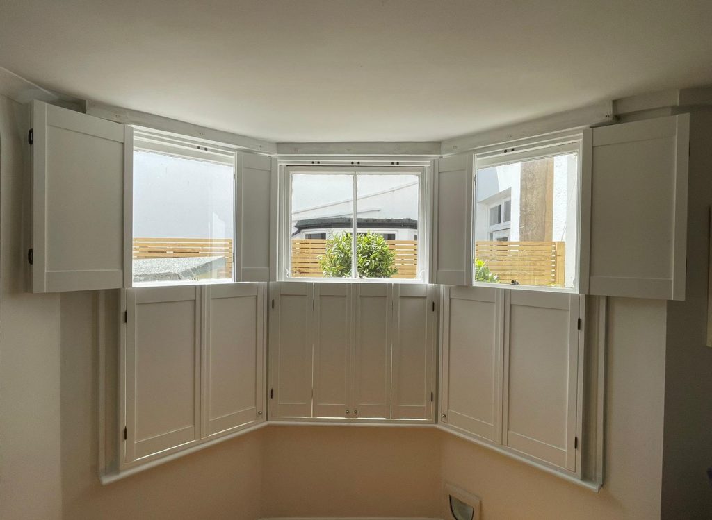 Bright room with cafe style shutters